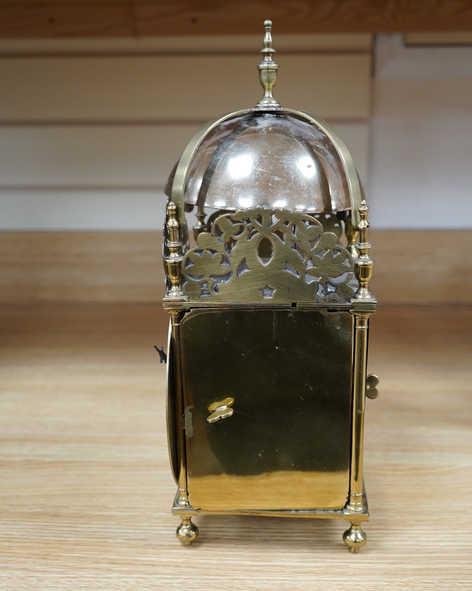 Manner of Richard Rayment of Bury. A Victorian 17th century style lantern clock, in traditional brass case with silvered Roman dial and eight day single fusee movement striking on a bell, 17cm wide, 14.5cm deep, 38cm hig